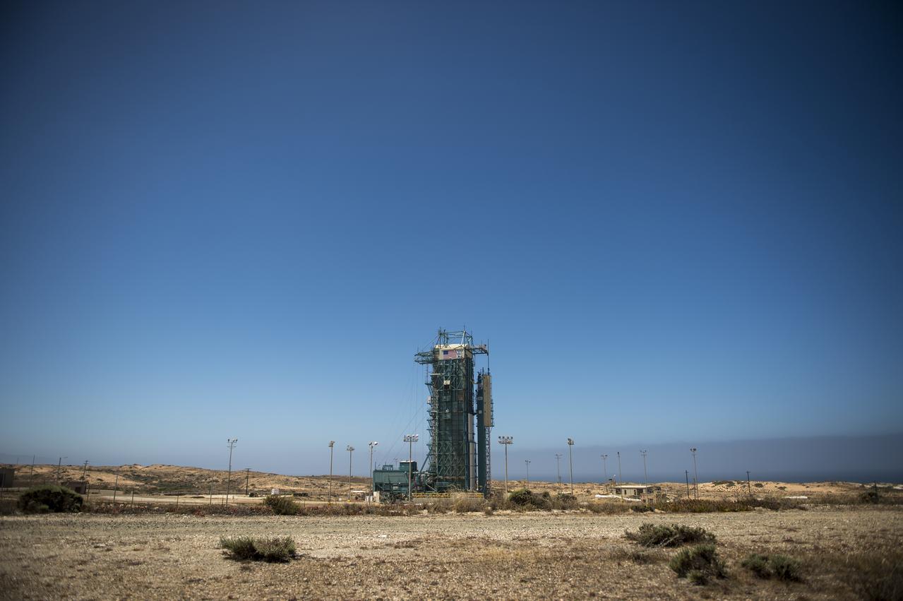 The launch gantry, surrounding the United Launch Alliance Delta II rocket with the Orbiting Carbon Observatory-2 (OCO-2) satellite onboard, is seen at the Space Launch Complex 2, Sunday, June 29, 2014, Vandenberg Air Force Base, Calif.  OCO-2 will measure the global distribution of carbon dioxide, the leading human-produced greenhouse gas driving changes in Earth’s climate.  OCO-2 is set for a July 1, 2014 launch. Photo Credit: (NASA/Bill Ingalls)