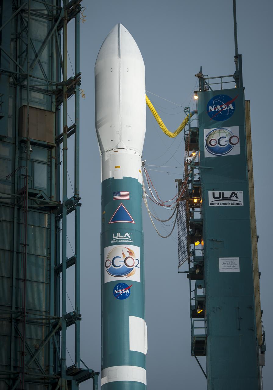 The United Launch Alliance Delta II rocket with the Orbiting Carbon Observatory-2 (OCO-2) satellite onboard, is seen as the launch gantry is moved at the Space Launch Complex 2, Monday, June 30, 2014, Vandenberg Air Force Base, Calif. OCO-2 will measure the global distribution of carbon dioxide, the leading human-produced greenhouse gas driving changes in Earth’s climate. OCO-2 is set for a July 1, 2014 launch. Photo Credit: (NASA/Bill Ingalls)