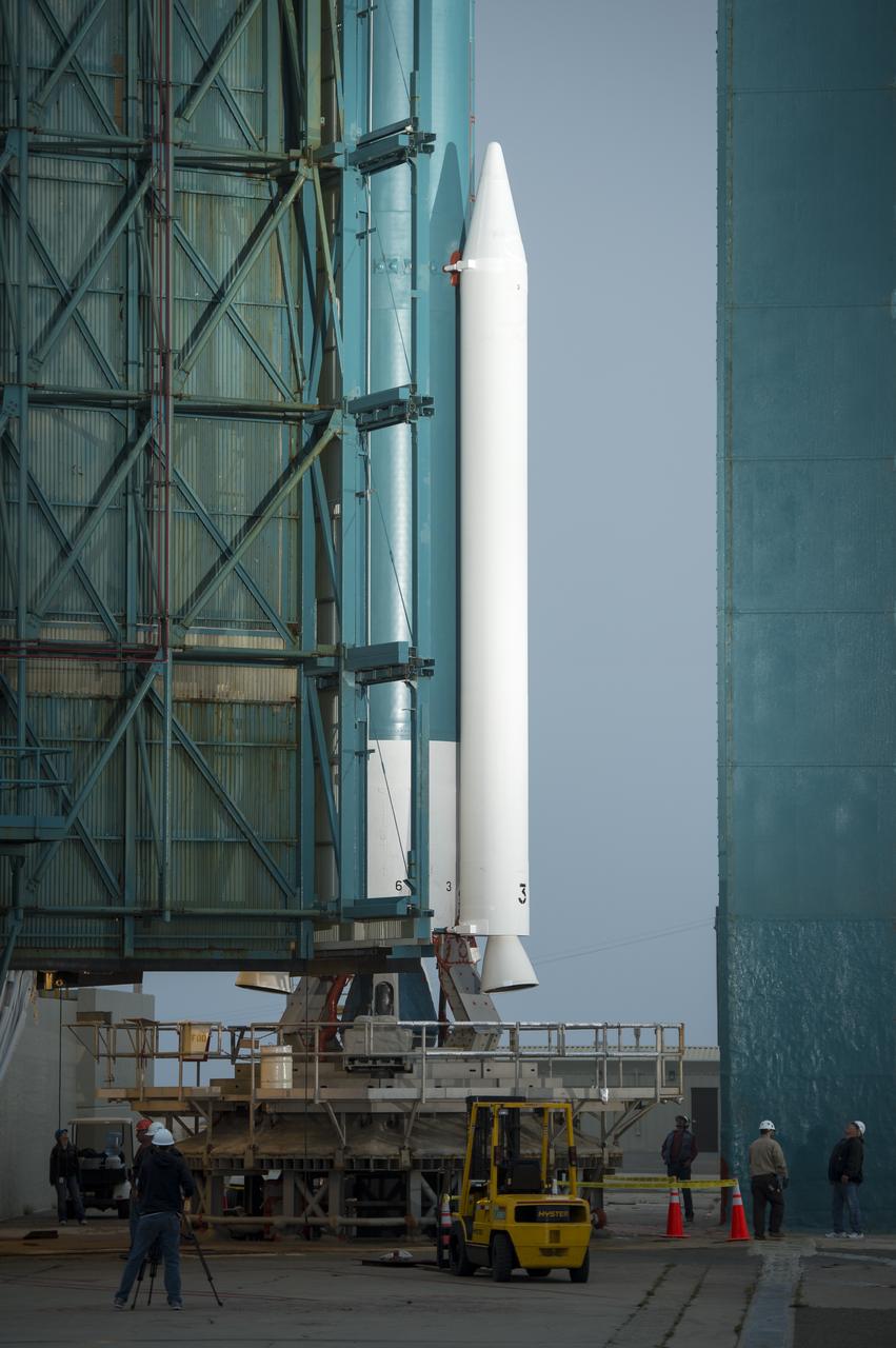 Workers monitor the progress of the rollback of the launch gantry from the United Launch Alliance Delta II rocket with the Orbiting Carbon Observatory-2 (OCO-2) satellite onboard, at Space Launch Complex 2, Monday, June 30, 2014, Vandenberg Air Force Base, Calif.  OCO-2 will measure the global distribution of carbon dioxide, the leading human-produced greenhouse gas driving changes in Earth’s climate.  OCO-2 is set for a July 1, 2014 launch. Photo Credit: (NASA/Bill Ingalls)