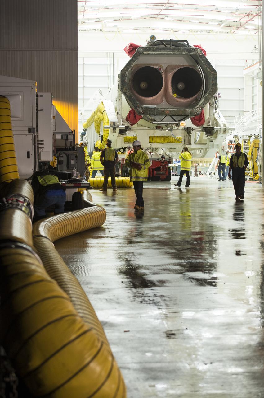 The Orbital Sciences Corporation Antares rocket, with the Cygnus spacecraft onboard, is rolled out of the Horizontal Integration Facility (HIF) to begin the approximately half-mile journey to launch Pad-0A, Thursday, July 10, 2014, at NASA's Wallops Flight Facility in Virginia. The Antares will launch with the Cygnus spacecraft filled with over 3,000 pounds of supplies for the International Space Station, including science experiments, experiment hardware, spare parts, and crew provisions. The Orbital-2 mission is Orbital Sciences' second contracted cargo delivery flight to the space station for NASA. Photo Credit: (NASA/Aubrey Gemignani)