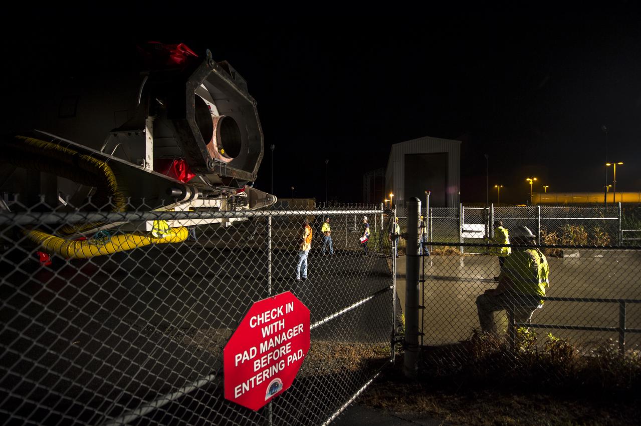 The Orbital Sciences Corporation Antares rocket, with the Cygnus spacecraft onboard, arrives at launch Pad-0A, Thursday, July 10, 2014, at NASA's Wallops Flight Facility in Virginia. The Antares will launch with the Cygnus spacecraft filled with over 3,000 pounds of supplies for the International Space Station, including science experiments, experiment hardware, spare parts, and crew provisions. The Orbital-2 mission is Orbital Sciences' second contracted cargo delivery flight to the space station for NASA. Photo Credit: (NASA/Bill Ingalls)