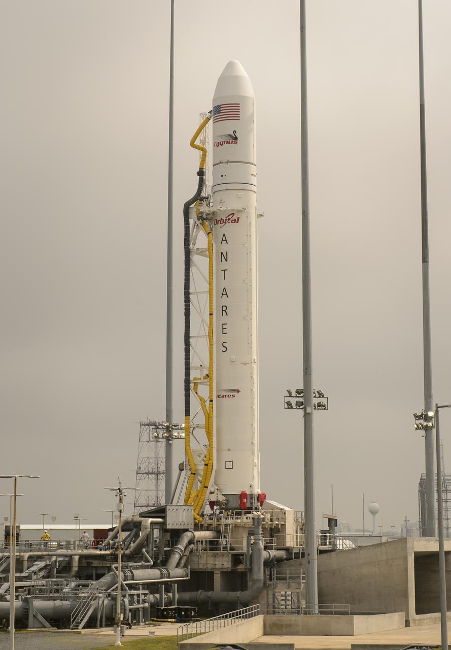 The Orbital Sciences Corporation Antares rocket, with the Cygnus spacecraft onboard, is seen on launch Pad-0A, Friday, July 11, 2014, at NASA's Wallops Flight Facility in Virginia. The Antares will launch with the Cygnus spacecraft filled with over 3,000 pounds of supplies for the International Space Station, including science experiments, experiment hardware, spare parts, and crew provisions. The Orbital-2 mission is Orbital Sciences' second contracted cargo delivery flight to the space station for NASA. Photo Credit: (NASA/Bill Ingalls)