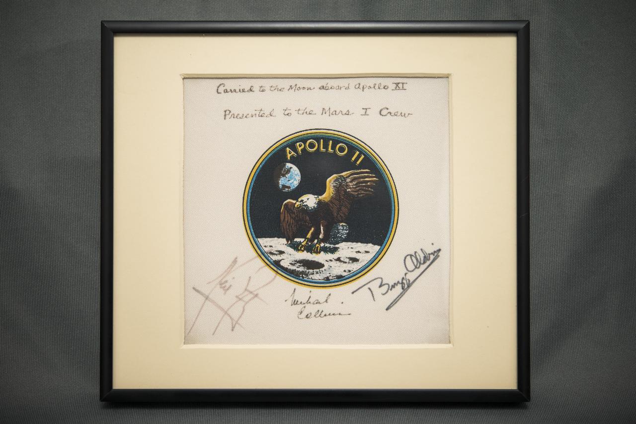 The description on the back of the plaque reads: "This plaque was presented to Administrator James C. Fletcher by the Apollo 11 Crew for award to the future Mars I crew (when the first manned mission to Mars is scheduled),  July 20, 1987 at The Case for Mars III Conference at the University of Colorado in Boulder, Colorado."  Photographed on Friday, July 11, 2014 in Washington, DC.  Photo Credit: (NASA/Joel Kowsky)