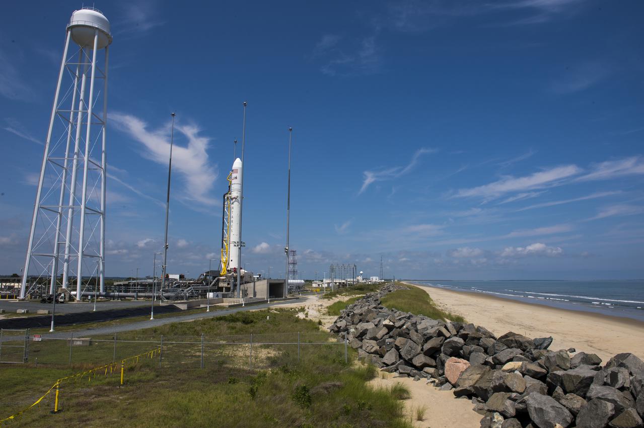 The Orbital Sciences Corporation Antares rocket, with the Cygnus spacecraft onboard, is seen on launch Pad-0A, Saturday, July 12, 2014, at NASA's Wallops Flight Facility in Virginia. The launch is planned for Sunday, July 13 and will carry the Cygnus spacecraft filled with over 3,000 pounds of supplies for the International Space Station, including science experiments, experiment hardware, spare parts, and crew provisions. The Orbital-2 mission is Orbital Sciences' second contracted cargo delivery flight to the space station for NASA. Photo Credit: (NASA/Aubrey Gemignani)