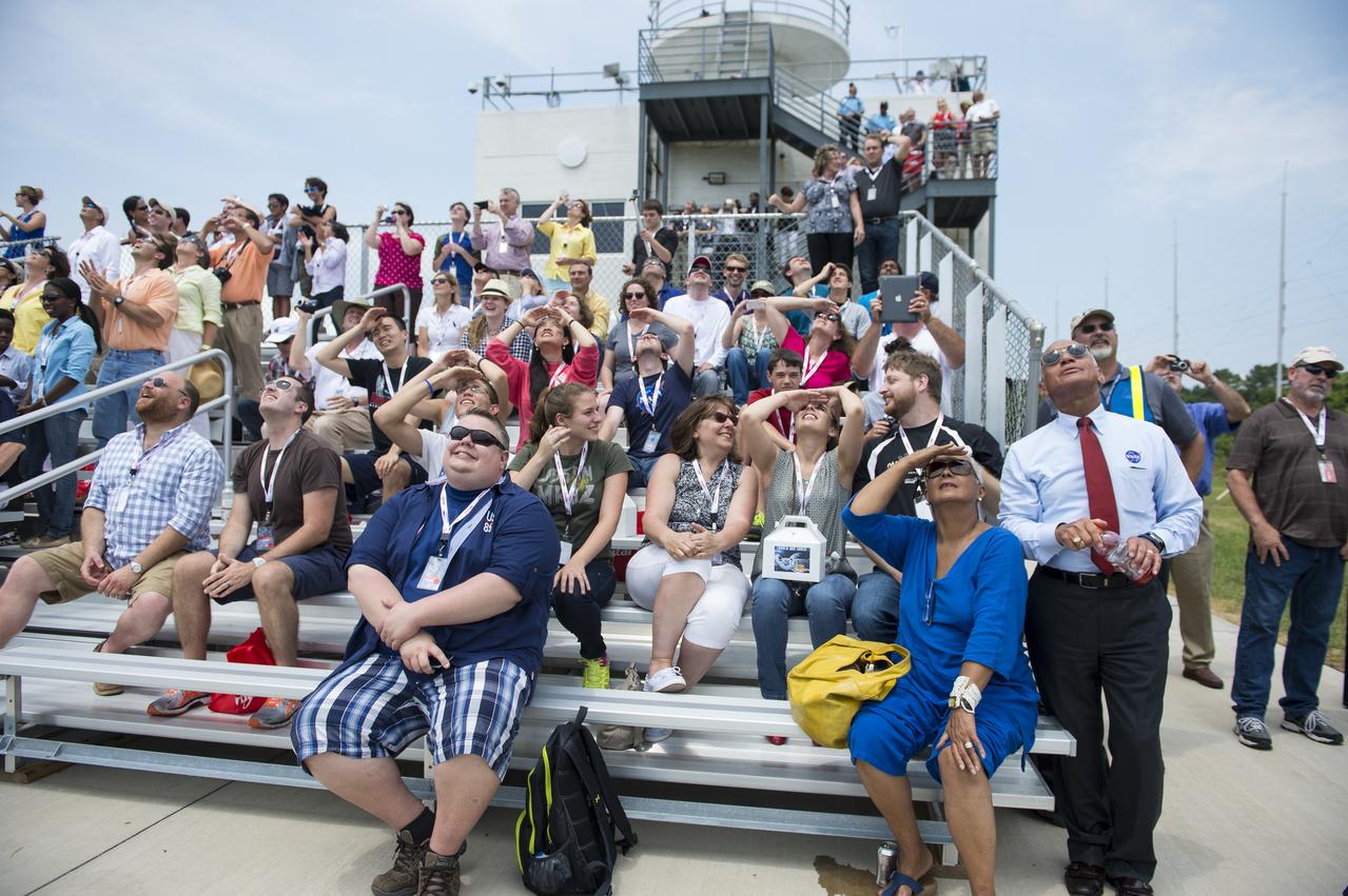 NASA Administrator Charles Bolden (right), his wife, Alexis Walker, and other guests watch the launch of the Orbital Sciences Corporation Antares rocket, with the Cygnus cargo spacecraft aboard, Sunday, July 13, 2014, at NASA’s Wallops Flight Facility in Virginia. Cygnus will deliver over 3,000 pounds of cargo to the Expedition 40 crew at the International Space Station, including science experiments, experiment hardware, spare parts, and crew provisions. Photo Credit: (NASA/Aubrey Gemignani)