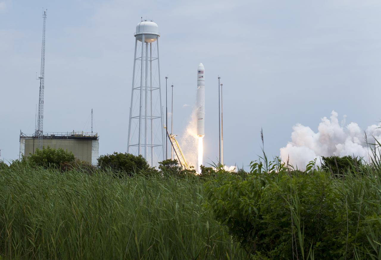 The Orbital Sciences Corporation Antares rocket launches from Pad-0A with the Cygnus spacecraft onboard, Sunday, July 13, 2014, at NASA's Wallops Flight Facility in Virginia. The Cygnus spacecraft is filled with over 3,000 pounds of supplies for the International Space Station, including science experiments, experiment hardware, spare parts, and crew provisions. The Orbital-2 mission is Orbital Sciences' second contracted cargo delivery flight to the space station for NASA. Photo Credit: (NASA/Aubrey Gemignani)