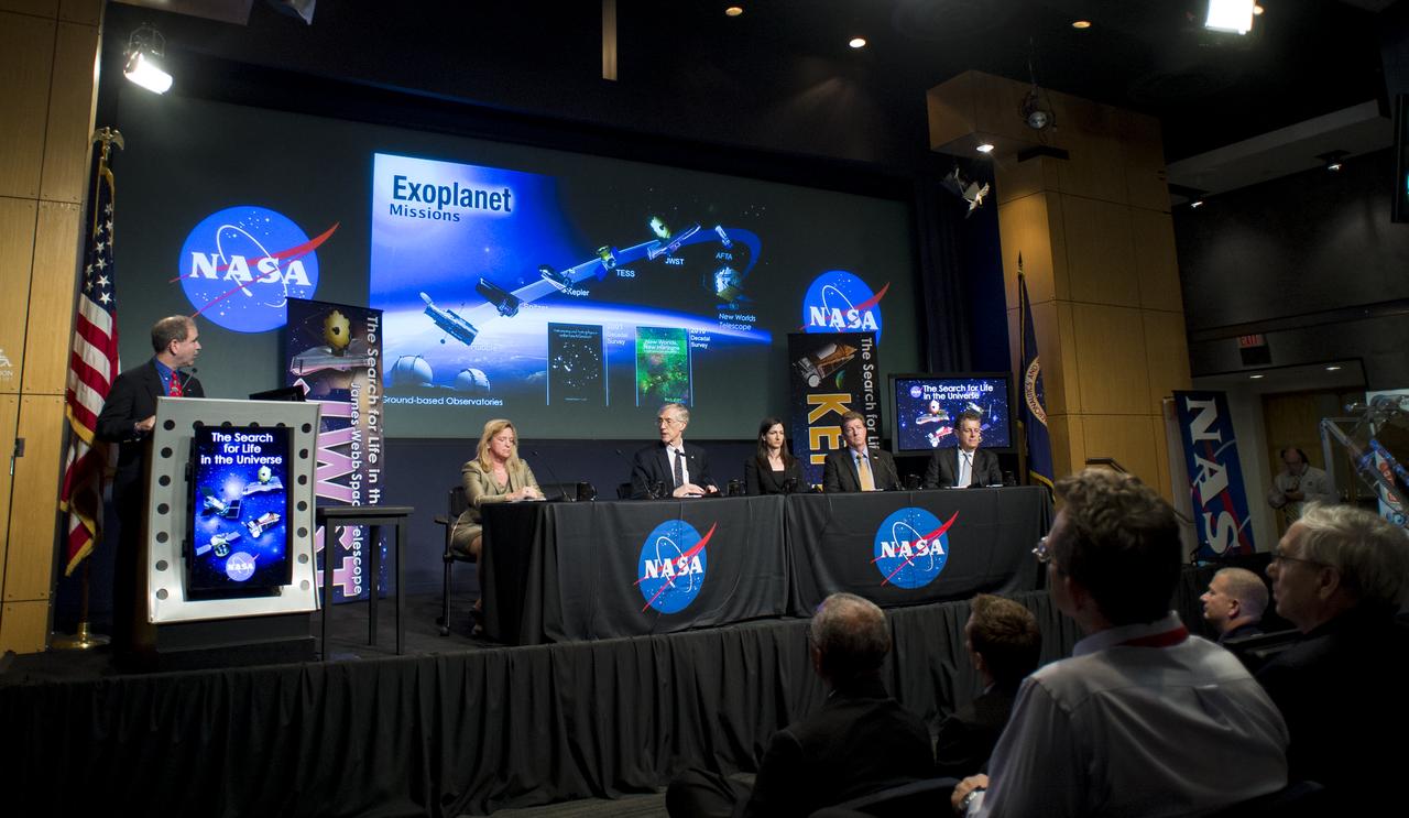 John Grunsfeld, Associate Administrator for NASA's Science Mission Directorate, far left, speaks during a panel discussion on the search for life beyond Earth in the James E. Webb Auditorium at NASA Headquarters on Monday, July 14, 2014 in Washington, DC. The panel discussed how NASA's space-based observatories are making new discoveries and how the agency's new telescope, the James Webb Space Telescope, will continue this path of discovery after its schedule launch in 2018. Photo Credit: (NASA/Joel Kowsky)