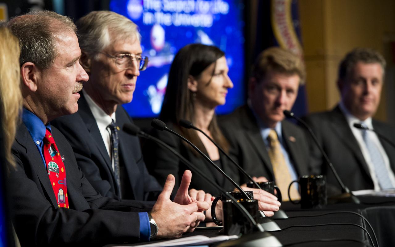 John Grunsfeld, Associate Administrator for NASA's Science Mission Directorate, far left, answers a question from the audience during a panel discussion on the search for life beyond Earth in the James E. Webb Auditorium at NASA Headquarters on Monday, July 14, 2014 in Washington, DC. The panel discussed how NASA's space-based observatories are making new discoveries and how the agency's new telescope, the James Webb Space Telescope, will continue this path of discovery after its schedule launch in 2018.   Photo Credit: (NASA/Joel Kowsky)