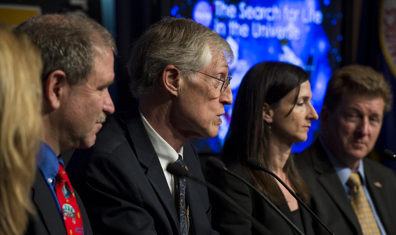 John Mather, Project Scientist for the James Webb Space Telescope at NASA's Goddard Space Flight Center, center, answers a question from the audience during a panel discussion on the search for life beyond Earth in the James E. Webb Auditorium at NASA Headquarters on Monday, July 14, 2014 in Washington, DC. The panel discussed how NASA's space-based observatories are making new discoveries and how the agency's new telescope, the James Webb Space Telescope, will continue this path of discovery after its schedule launch in 2018.   Photo Credit: (NASA/Joel Kowsky)