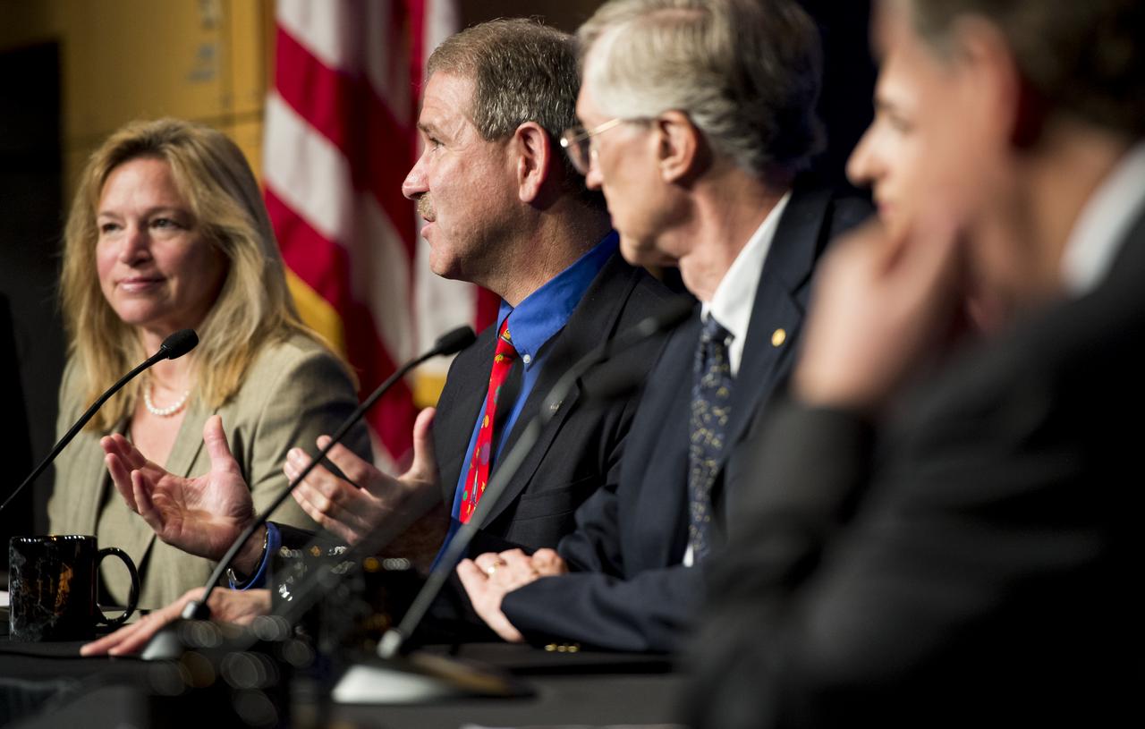 John Grunsfeld, Associate Administrator for NASA's Science Mission Directorate, second from left, answers a question from the audience during a panel discussion on the search for life beyond Earth in the James E. Webb Auditorium at NASA Headquarters on Monday, July 14, 2014 in Washington, DC. The panel discussed how NASA's space-based observatories are making new discoveries and how the agency's new telescope, the James Webb Space Telescope, will continue this path of discovery after its schedule launch in 2018.   Photo Credit: (NASA/Joel Kowsky)