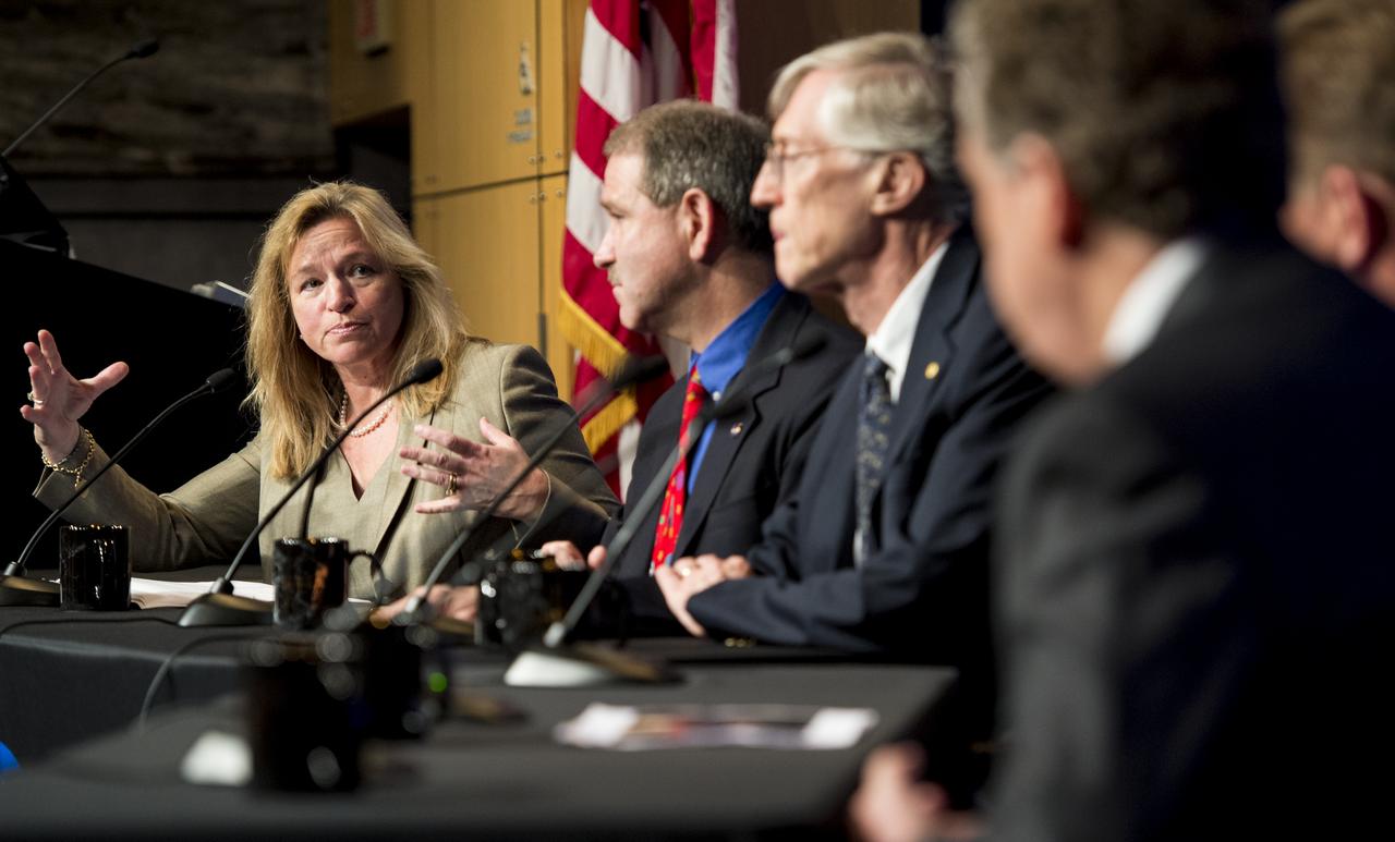 NASA Chief Scientist Ellen Stofan, far left, asks the members of the panel a question during a discussion of the search for life beyond Earth in the James E. Webb Auditorium at NASA Headquarters on Monday, July 14, 2014 in Washington, DC. The panel discussed how NASA's space-based observatories are making new discoveries and how the agency's new telescope, the James Webb Space Telescope, will continue this path of discovery after its schedule launch in 2018.   Photo Credit: (NASA/Joel Kowsky)