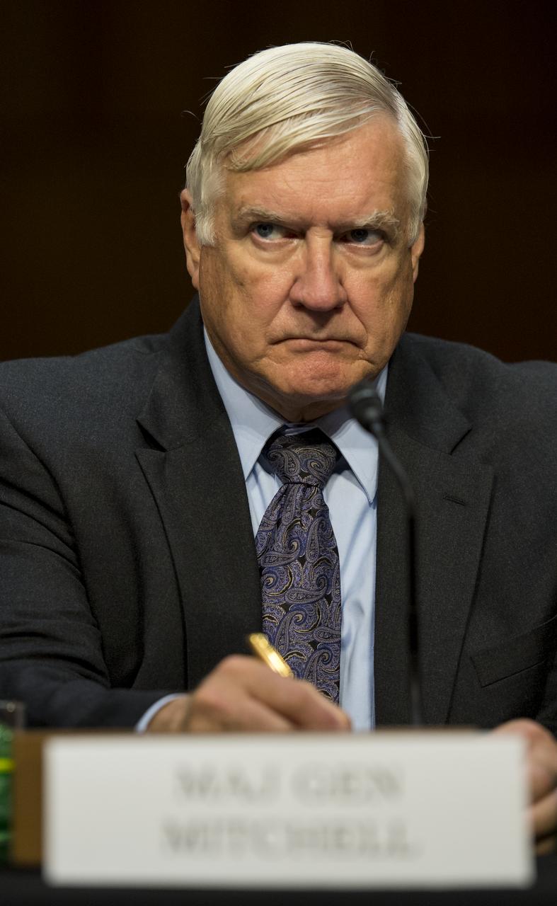 Howard Mitchell, Vice President of Program Assessments at The Aerospace Corporation, listens to opening statements during a hearing in front of the Senate Subcommittee on Strategic Forces and Senate Committee on Commerce, Science, and Transportation on Wednesday, July 16, 2014, at the Hart Senate Office Building in Washington, DC. The Senate hearing focused on assured access to space.