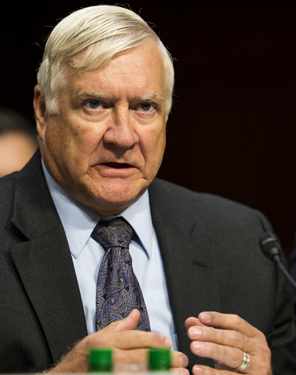Howard Mitchell, Vice President of Program Assessments at The Aerospace Corporation, delivers his opening statement during a hearing in front of the Senate Subcommittee on Strategic Forces and Senate Committee on Commerce, Science, and Transportation on Wednesday, July 16, 2014, at the Hart Senate Office Building in Washington, DC. The Senate hearing focused on assured access to space.