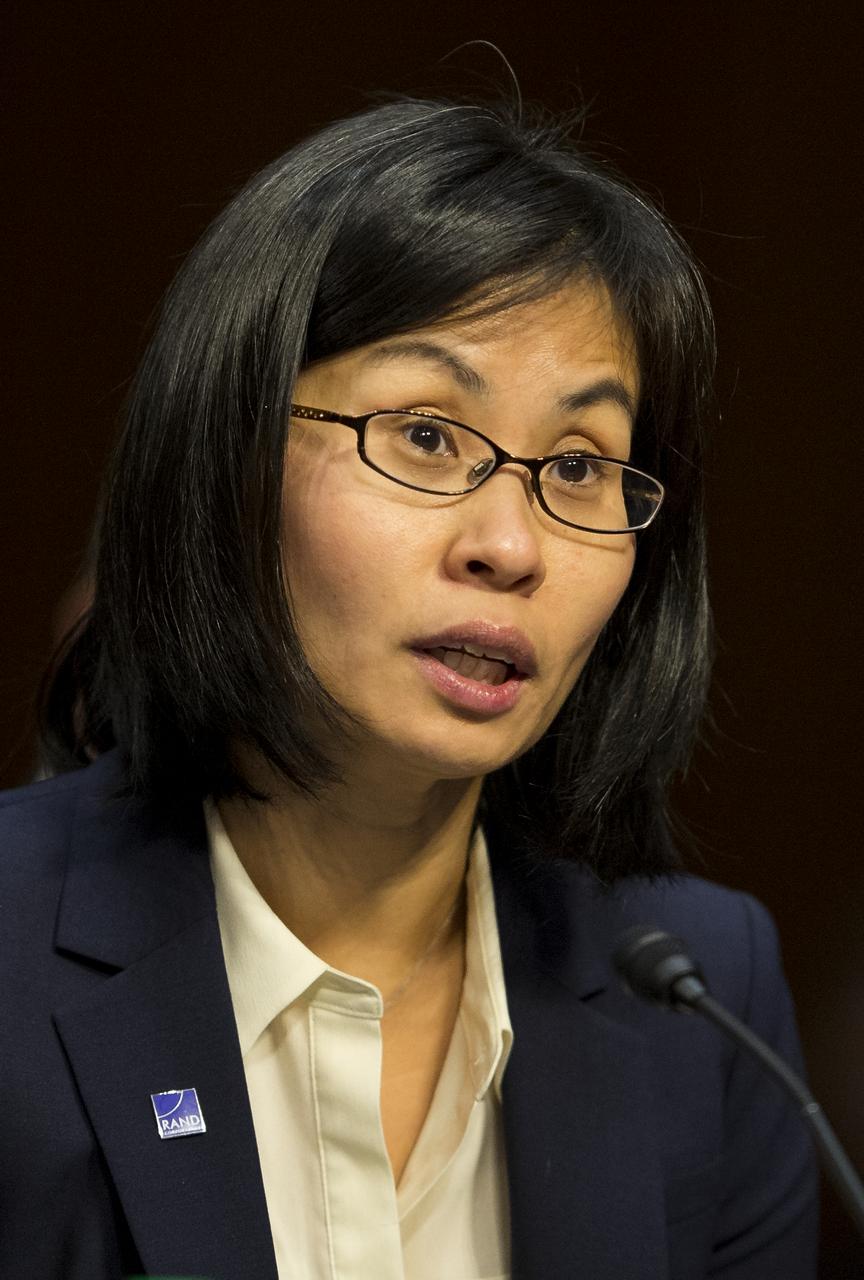 Dr. Yool Kim, Senior Engineer at the Rand Corporation, delivers her opening statment during a hearing in front of the Senate Subcommittee on Strategic Forces and Senate Committee on Commerce, Science, and Transportation on Wednesday, July 16, 2014, at the Hart Senate Office Building in Washington, DC. The Senate hearing focused on assured access to space.