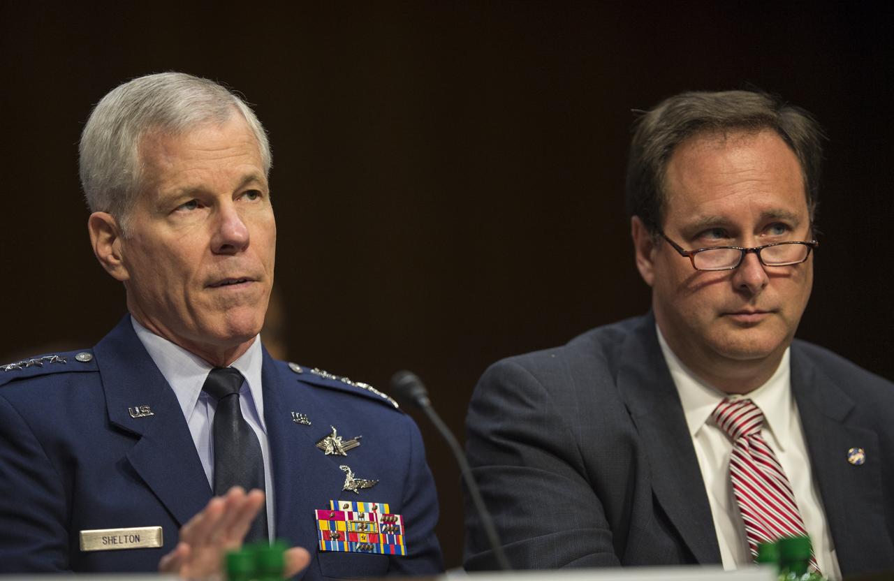 General William Sherlton, Commander of the United States Air Force Space Command, left; answers a question during testimony in front of the Senate Subcommittee on Strategic Forces and Senate Committee on Commerce, Science, and Transportation on Wednesday, July 16, 2014, at the Hart Senate Office Building in Washington, DC. The Senate hearing focused on assured access to space.