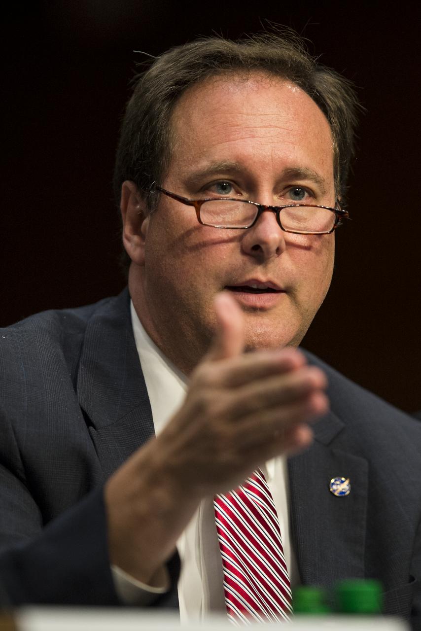 Robert Lightfoot, NASA Associate Administrator, answers a question during testimony in front of the Senate Subcommittee on Strategic Forces and Senate Committee on Commerce, Science, and Transportation on Wednesday, July 16, 2014, at the Hart Senate Office Building in Washington, DC. The Senate hearing focused on assured access to space.