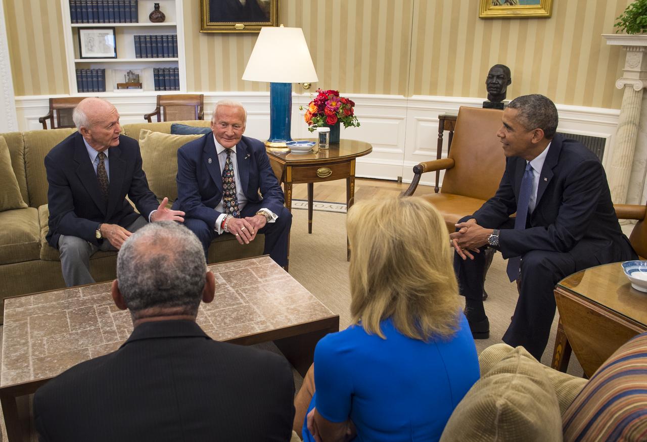 President Barack Obama meets with Apollo 11 astronauts Michael Collins, seated left, Buzz Aldrin, center, Carol Armstrong, widow of Apollo 11 commander, Neil Armstrong, and NASA Administrator Charles Bolden, Tuesday, July 22, 2014, in the Oval Office of the White House in Washington, during the 45th anniversary week of the Apollo 11 lunar landing. Photo Credit: (NASA/Bill Ingalls)