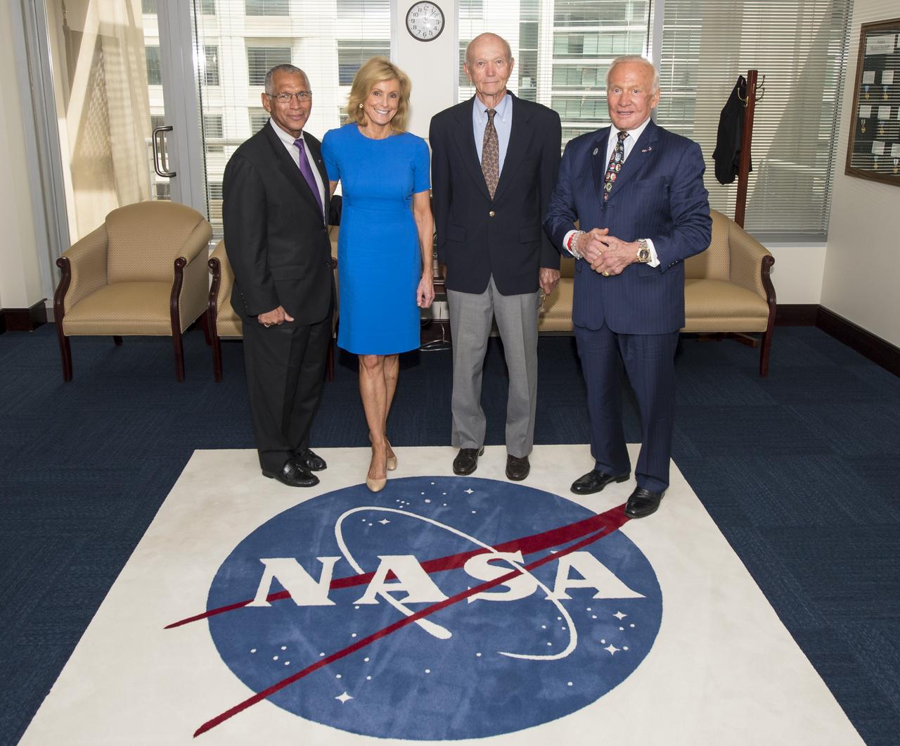 NASA Administrator Charles Bolden, left, welcomes Carol Armstrong, widow of Apollo 11 commander, Neil Armstrong, Apollo 11 astronauts Michael Collins and Buzz Aldrin, right, to NASA Headquarters in Washington on Tuesday, July 22, 2014, during the 45th anniversary week of the Apollo 11 lunar landing. Photo Credit: (NASA/Joel Kowsky)