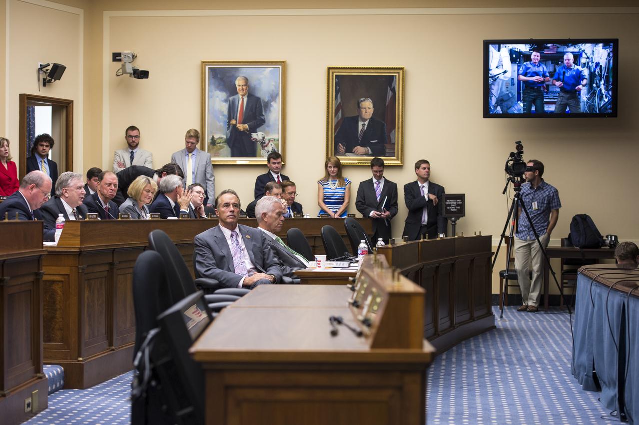Representative Steve Stockman (R-TX) asks astronauts Steve Swanson and Reid Wisemen a question at the live downlink with the International Space Station (ISS) Thursday, July 24, 2014 at the Rayburn House Office Building in Washington, DC. The event provided members of the Committee on Science, Space, and Technology the opportunity to ask Expedition 40 astronauts Steve Swanson and Reid Wiseman questions about their time living and working at the ISS. They are scheduled to return to Earth toward the end of this year.