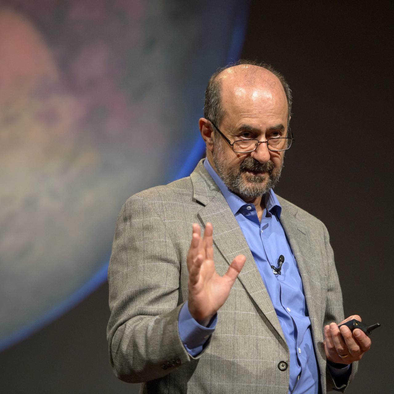 Marc Kaufman, space news writer, National Geographic and The Washington Post, and author of the new National Geographic book “Mars Up Close”, kicks off a panel discussion of Mars experts involved in current Mars exploration, Tuesday, August 5, 2014, at the National Geographic Society headquarters in Washington. The panelist shared what we’ve learned from Curiosity and the other Mars rovers surveying the red planet.  Photo Credit: (NASA/Bill Ingalls)