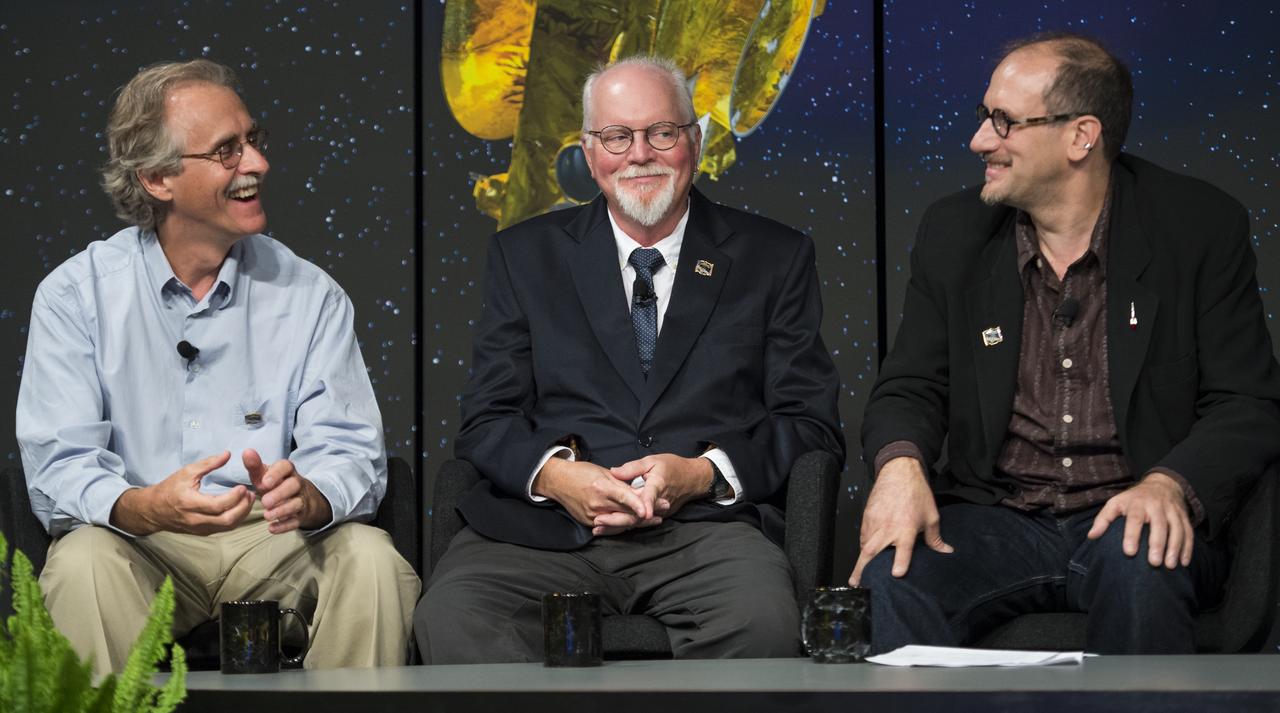 Dr. John Spencer, senior scientist at the Southwest Research Institute, left, Dr. Jeffrey Moore, senior scientist at NASA Ames Researh Center, center, and Dr. David H. Grinspoon, senior scientist at the Plentary Science Institute, left, are seen during a panel discussion at the "NASA's New Horizons Pluto Mission: Continuing Voyager's Legacy of Exploration" event on Monday, August, 25, 2014, in the James E. Webb Auditorium at NASA Headquarters in Washington, DC.  The panelists gave their accounts of Voyager's encounter with Neptune and discussed their current assignments on NASA's New Horizons mission to Pluto.  Photo Credit: (NASA/Joel Kowsky)