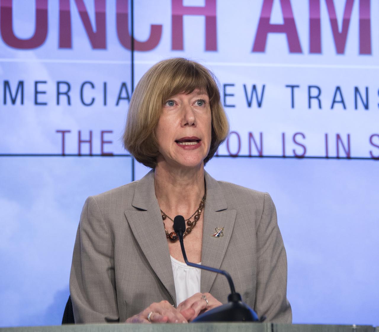 Kathy Lueders, program manager of NASA's Commercial Crew Program, speaks during a news conference where it was announced that Boeing and SpaceX have been selected to transport U.S. crews to and from the International Space Station using the Boeing CST-100 and the SpaceX Crew Dragon spacecraft, at NASA’s Kennedy Space Center in Cape Canaveral, Fla. on Tuesday, Sept. 16, 2014. These Commercial Crew Transportation Capability (CCtCap) contracts are designed to complete the NASA certification for a human space transportation system capable of carrying people into orbit. Once certification is complete, NASA plans to use these systems to transport astronauts to the space station and return them safely to Earth.  Photo Credit: (NASA/Bill Ingalls)