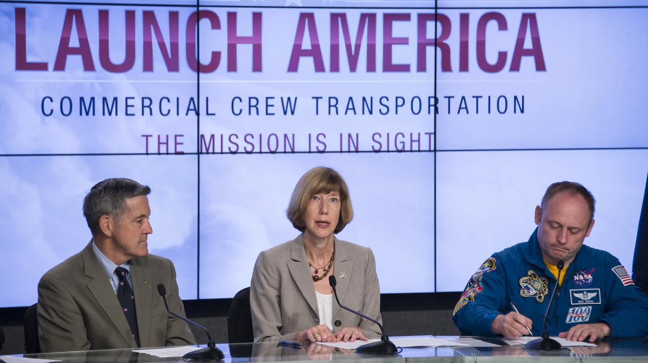 Kathy Lueders, program manager of NASA's Commercial Crew Program, speaks, as Former astronaut Bob Cabana, director of NASA's Kennedy Space Center in Florida, left, and Astronaut Mike Fincke, a former commander of the International Space Station look on during a news conference where it was announced that Boeing and SpaceX have been selected to transport U.S. crews to and from the International Space Station using the Boeing CST-100 and the SpaceX Crew Dragon spacecraft, at NASA’s Kennedy Space Center in Cape Canaveral, Fla. on Tuesday, Sept. 16, 2014. These Commercial Crew Transportation Capability (CCtCap) contracts are designed to complete the NASA certification for a human space transportation system capable of carrying people into orbit. Once certification is complete, NASA plans to use these systems to transport astronauts to the space station and return them safely to Earth.  Photo Credit: (NASA/Bill Ingalls)
