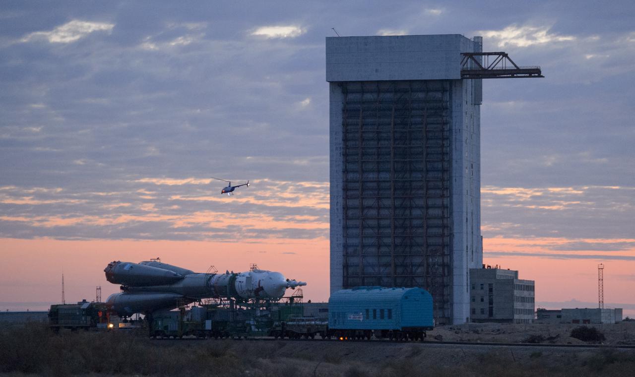 The Soyuz TMA-14M spacecraft is rolled out to the launch pad by train on Tuesday, Sept. 23, 2014 at the Baikonur Cosmodrome in Kazakhstan.  Launch of the Soyuz rocket is scheduled for Sept. 26 and will carry Expedition 41 Soyuz Commander Alexander Samokutyaev of the Russian Federal Space Agency (Roscosmos), Flight Engineer Barry Wilmore of NASA, and Flight Engineer Elena Serova of Roscosmos into orbit to begin their five and a half month mission on the International Space Station. Photo Credit: (NASA/Joel Kowsky)