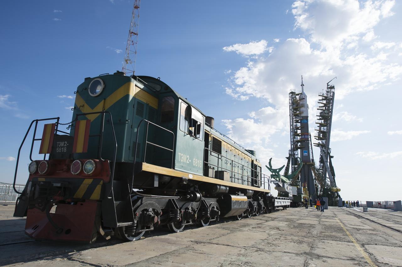 The gantry arms begin to close around the Soyuz TMA-14M spacecraft to secure the rocket at the launch pad Sept. 23, 2014 at the Baikonur Cosmodrome in Kazakhstan. Launch of the Soyuz rocket is scheduled for Sept. 26 and will carry Expedition 41 Soyuz Commander Alexander Samokutyaev of the Russian Federal Space Agency (Roscosmos), Flight Engineer Barry Wilmore of NASA, and Flight Engineer Elena Serova of Roscosmos into orbit to begin their five and a half month mission on the International Space Station. Photo Credit: (NASA/Joel Kowsky)