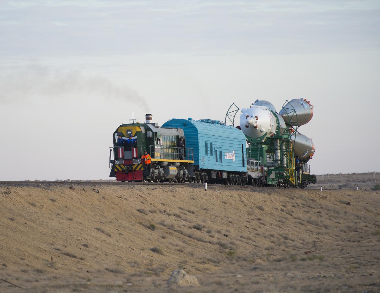 The Soyuz TMA-14M spacecraft is rolled out to the launch pad by train on Tuesday, Sept. 23, 2014 at the Baikonur Cosmodrome in Kazakhstan.  Launch of the Soyuz rocket is scheduled for Sept. 26 and will carry Expedition 41 Soyuz Commander Alexander Samokutyaev of the Russian Federal Space Agency (Roscosmos), Flight Engineer Barry Wilmore of NASA, and Flight Engineer Elena Serova of Roscosmos into orbit to begin their five and a half month mission on the International Space Station. Photo Credit: (NASA/Aubrey Gemignani)