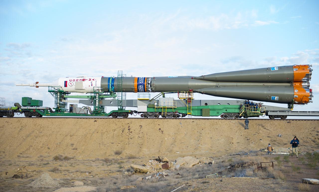 The Soyuz TMA-14M spacecraft is rolled out to the launch pad by train on Tuesday, Sept. 23, 2014 at the Baikonur Cosmodrome in Kazakhstan.  Launch of the Soyuz rocket is scheduled for Sept. 26 and will carry Expedition 41 Soyuz Commander Alexander Samokutyaev of the Russian Federal Space Agency (Roscosmos), Flight Engineer Barry Wilmore of NASA, and Flight Engineer Elena Serova of Roscosmos into orbit to begin their five and a half month mission on the International Space Station. Photo Credit: (NASA/Aubrey Gemignani)