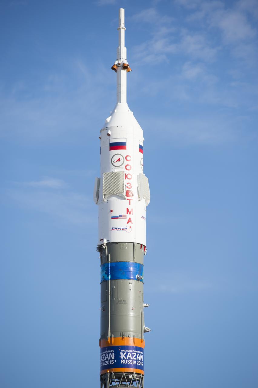 The Soyuz TMA-14M spacecraft is seen after being raised into a vertical position on the launch pad on Tuesday, Sept. 23, 2014 at the Baikonur Cosmodrome in Kazakhstan.  Launch of the Soyuz rocket is scheduled for Sept. 26 and will carry Expedition 41 Soyuz Commander Alexander Samokutyaev of the Russian Federal Space Agency (Roscosmos), Flight Engineer Barry Wilmore of NASA, and Flight Engineer Elena Serova of Roscosmos into orbit to begin their five and a half month mission on the International Space Station. The rocket is adorned with the logo of the 2015 FINA World Aquatics Championships, which will be held in Kazan, Russia. Photo Credit: (NASA/Aubrey Gemignani)