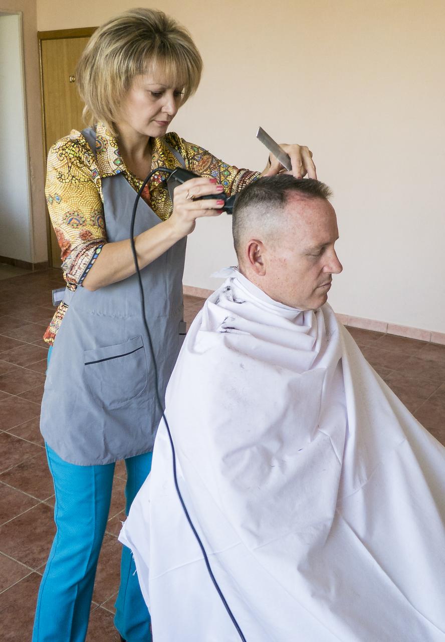 Expedition 41 Flight Engineer Barry Wilmore gets his hair cut at the Cosmonaut Hotel, on Tuesday, Sept. 23, 2014, at the Baikonur Cosmodrome in Kazakhstan. Launch of the Soyuz is scheduled for Sept. 26 and will send Barry Wilmore of NASA, Soyuz Commander Alexander Samokutyaev of the Russian Federal Space Agency (Roscosmos), and Flight Engineer Elena Serova of Roscosmos to the International Space Station for a five and a half month stay.  Photo Credit: (NASA/Dr. Peter Bauer)