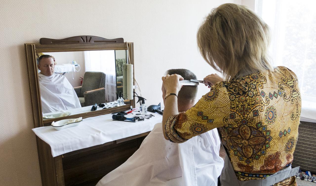 Expedition 41 Flight Engineer Barry Wilmore gets his hair cut at the Cosmonaut Hotel, on Tuesday, Sept. 23, 2014, at the Baikonur Cosmodrome in Kazakhstan. Launch of the Soyuz is scheduled for Sept. 26 and will send Barry Wilmore of NASA, Soyuz Commander Alexander Samokutyaev of the Russian Federal Space Agency (Roscosmos), and Flight Engineer Elena Serova of Roscosmos to the International Space Station for a five and a half month stay.  Photo Credit: (NASA/Dr. Peter Bauer)