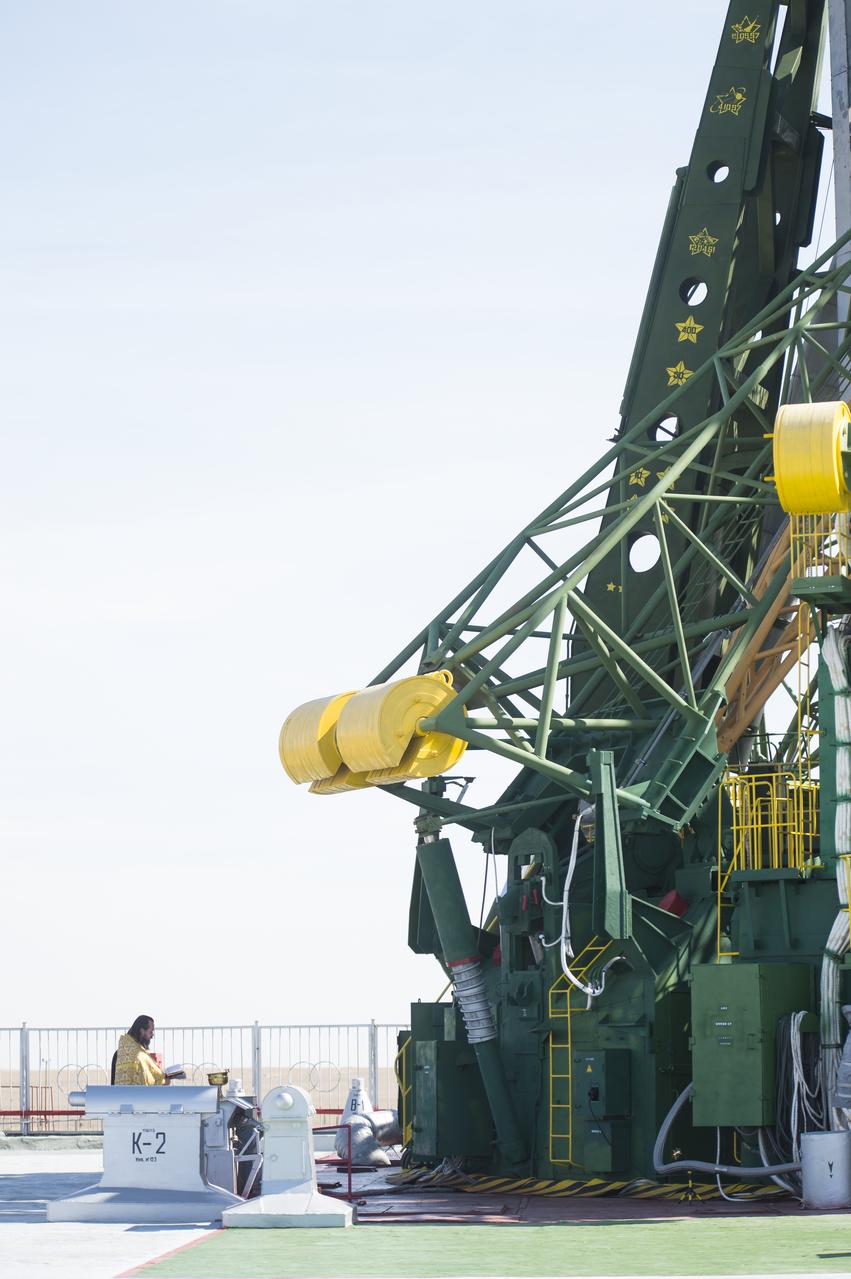 An Orthodox priest blesses the Soyuz rocket at the Baikonur Cosmodrome launch pad on Wednesday, Sept. 24, 2014, in Kazakhstan. Launch of the Soyuz rocket is scheduled for Sept. 26 and will carry Expedition 41 Soyuz Commander Alexander Samokutyaev of the Russian Federal Space Agency (Roscosmos), Flight Engineer Barry Wilmore of NASA, and Flight Engineer Elena Serova of Roscosmos into orbit to begin their five and a half month mission on the International Space Station. Photo Credit: (NASA/Aubrey Gemignani)