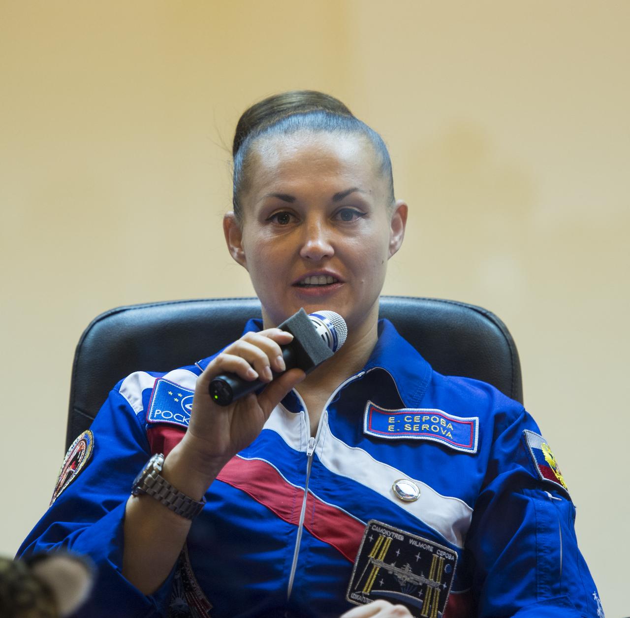 Expedition 41 Flight Engineer Elena Serova of the Russian Federal Space Agency (Roscosmos), answers a question during a press conference on Wednesday, Sept. 24, 2014, at the Cosmonaut Hotel in Baikonur, Kazakhstan. Launch of the Soyuz rocket is scheduled for Sept. 26 and will carry Serova, Soyuz Commander Alexander Samokutyaev of Roscosmos, and Flight Engineer Barry Wilmore of NASA into orbit to begin their five and a half month mission on the International Space Station. Serova will become the fourth Russian woman to fly in space and the first Russian woman to live and work on the station. Photo Credit: (NASA/Aubrey Gemignani)