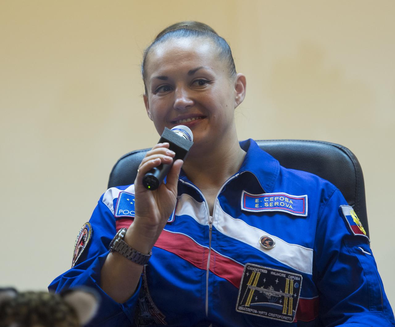 Expedition 41 Flight Engineer Elena Serova of the Russian Federal Space Agency (Roscosmos), answers a question during a press conference on Wednesday, Sept. 24, 2014, at the Cosmonaut Hotel in Baikonur, Kazakhstan. Launch of the Soyuz rocket is scheduled for Sept. 26 and will carry Serova, Soyuz Commander Alexander Samokutyaev of Roscosmos, and Flight Engineer Barry Wilmore of NASA into orbit to begin their five and a half month mission on the International Space Station. Serova will become the fourth Russian woman to fly in space and the first Russian woman to live and work on the station. Photo Credit: (NASA/Aubrey Gemignani)