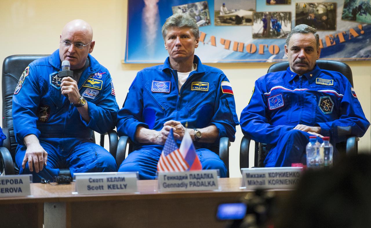 Expedition 41 backup crew members, Flight Engineer Scott Kelly of NASA, left, Soyuz Commander Gennady Padalka of Roscosmos, center, and Flight Engineer Mikhail Kornienko of Roscosmos, right, are seen during a press conference held at the Cosmonaut Hotel in Baikonur, Kazakhstan on Wednesday, Sept. 24, 2014. The prime crew of Flight Engineer Barry Wilmore of NASA, Soyuz Commander Alexander Samokutyaev, of Roscosmos, and Flight Engineer Elena Serova of Roscosmos are set to launch to the International Space Station on Sept. 26 from the Baikonur Cosmodrome. Photo Credit: (NASA/Joel Kowsky)