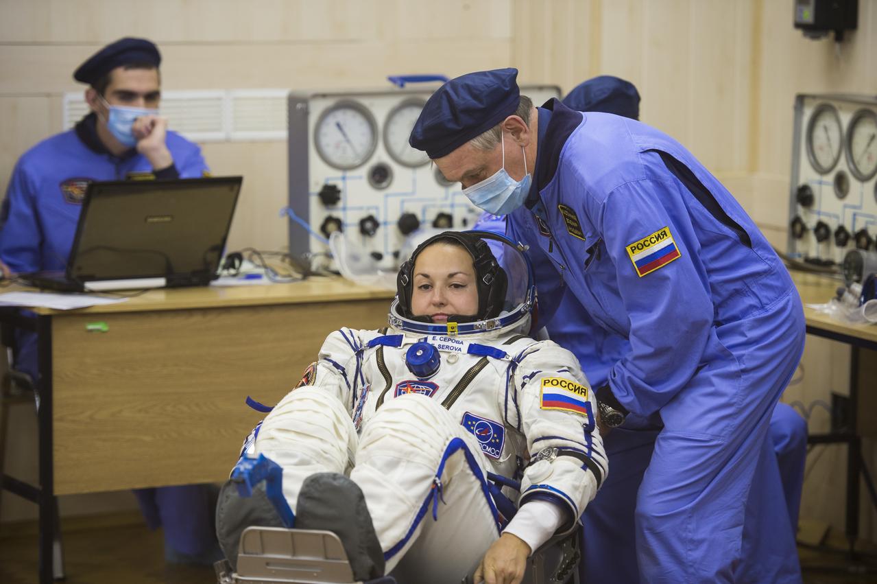 Expedition 41 Flight Engineer Elena Serova of the Russian Federal Space Agency (Roscosmos) has her Russian Sokol suit pressure checked in preparation for her launch aboard the Soyuz TMA-14M spacecraft on Thursday, Sept. 25, 2014, at the Baikonur Cosmodrome in Baikonur, Kazakhstan. Launch of the Soyuz rocket is scheduled for the early hours of Sept. 26 (Kazakhstan time) and will carry Serova and fellow crewmates, Soyuz Commander Alexander Samokutyaev of Roscosmos and Flight Engineer Barry Wilmore of NASA, into orbit to begin their five and a half month mission on the International Space Station. Serova will become the fourth Russian woman to fly in space and the first Russian woman to live and work on the station. Photo Credit: (NASA/Aubrey Gemignani)