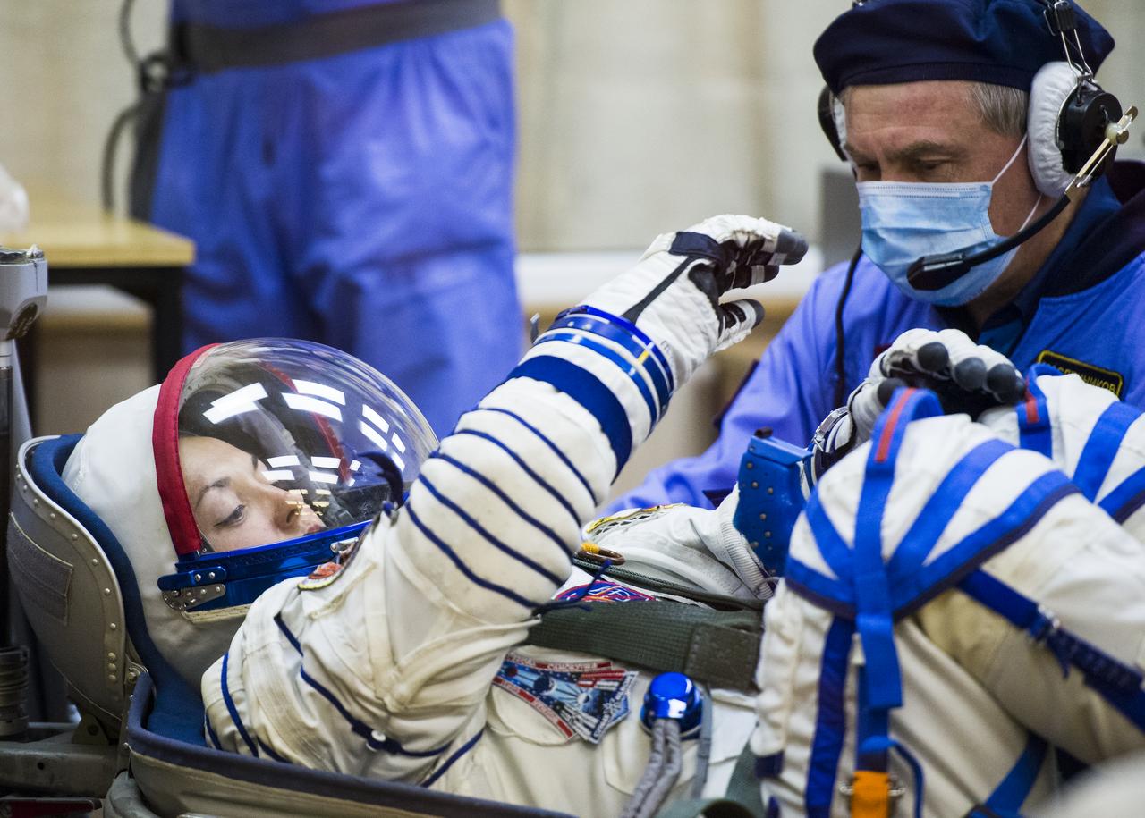 Expedition 41 Flight Engineer Elena Serova of the Russian Federal Space Agency (Roscosmos) has her Russian Sokol suit pressure checked in preparation for her launch onboard the Soyuz TMA-14M spacecraft on Thursday, September 25, 2014, at the Baikonur Cosmodrome in Kazakhstan.  The Soyuz spacecraft with Serova, Expedition 41 Soyuz Commander Alexander Samokutyaev of Roscosmos and Flight Engineer Barry WIlmore of NASA is scheduled to launch at 2:25 a.m. Kazakhstan Time on Friday, September 26.  Serova will become the fourth Russian woman to fly in space and the first Russian woman to live and work on the station. Photo Credit: (NASA/Joel Kowsky)