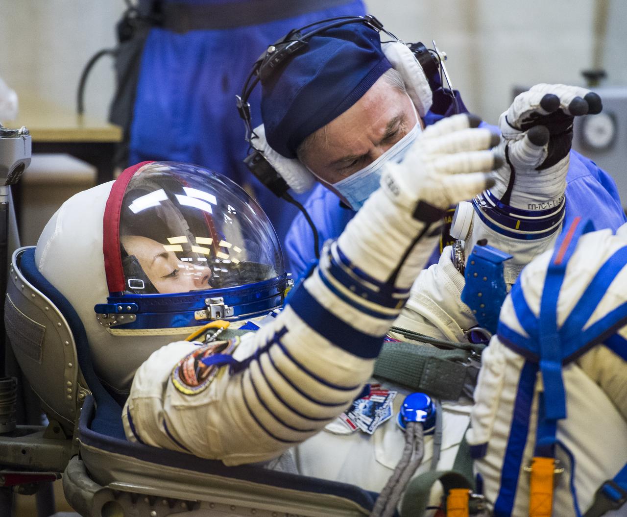 Expedition 41 Flight Engineer Elena Serova of the Russian Federal Space Agency (Roscosmos) has her Russian Sokol suit pressure checked in preparation for her launch onboard the Soyuz TMA-14M spacecraft on Thursday, September 25, 2014, at the Baikonur Cosmodrome in Kazakhstan.  The Soyuz spacecraft with Serova, Expedition 41 Soyuz Commander Alexander Samokutyaev of Roscosmos and Flight Engineer Barry WIlmore of NASA is scheduled to launch at 2:25 a.m. Kazakhstan Time on Friday, September 26.  Serova will become the fourth Russian woman to fly in space and the first Russian woman to live and work on the station. Photo Credit: (NASA/Joel Kowsky)