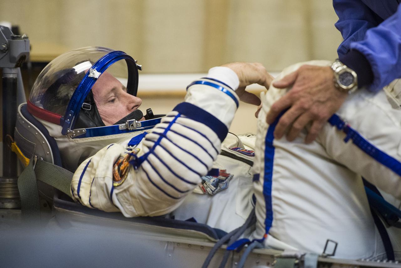 Expedition 41 Flight Engineer Barry Wilmore of NASA prepares to have his Russian Sokol suit pressure checked in preparation for his launch onboard the Soyuz TMA-14M spacecraft on Thursday, September 25, 2014, at the Baikonur Cosmodrome in Kazakhstan.  The Soyuz spacecraft with Wilmore, Expedition 41 Soyuz Commander Alexander Samokutyaev and Flight Engineer Elena Serova of the Russian Federal Space Agency (Roscosmos) is scheduled to launch at 2:25 a.m. Kazakhstan Time on Friday, September 26. Photo Credit: (NASA/Joel Kowsky)