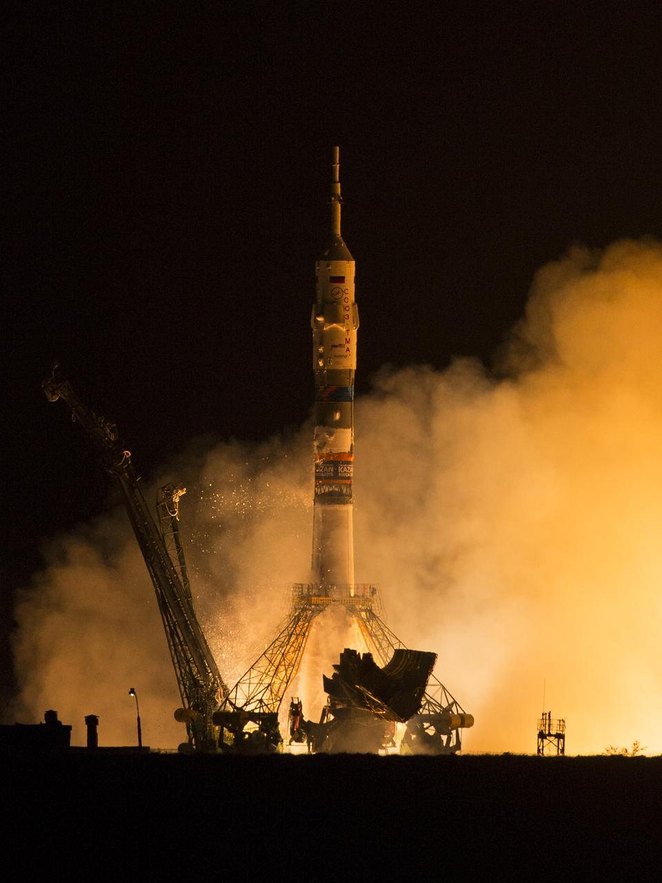 The Soyuz TMA-14M rocket launches from the Baikonur Cosmodrome in Kazakhstan on Friday, Sept. 26, 2014 carrying Expedition 41 Soyuz Commander Alexander Samokutyaev of the Russian Federal Space Agency (Roscosmos), Flight Engineer Barry Wilmore of NASA, and Flight Engineer Elena Serova of Roscosmos into orbit to begin their five and a half month mission on the International Space Station. (Photo Credit: NASA/Aubrey Gemignani)