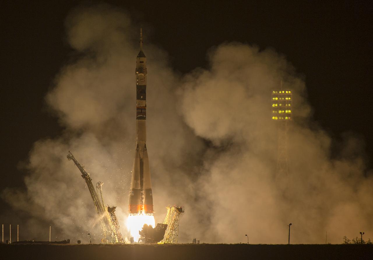 The Soyuz TMA-14M rocket is launched with Expedition 41 Soyuz Commander Alexander Samokutyaev of the Russian Federal Space Agency (Roscosmos) Flight Engineer Elena Serova of Roscosmos, and Flight Engineer Barry Wilmore of NASA, Friday, September 26, 2014 at the Baikonur Cosmodrome in Kazakhstan. Samokutyaev, Serova, and Wilmore will spend the next five and a half months aboard the International Space Station.  Serova will become the fourth Russian woman to fly in space and the first Russian woman to live and work on the station. Photo Credit: (NASA/Joel Kowsky)