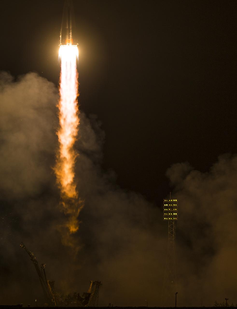 The Soyuz TMA-14M rocket is launched with Expedition 41 Soyuz Commander Alexander Samokutyaev of the Russian Federal Space Agency (Roscosmos) Flight Engineer Elena Serova of Roscosmos, and Flight Engineer Barry Wilmore of NASA, Friday, September 26, 2014 at the Baikonur Cosmodrome in Kazakhstan. Samokutyaev, Serova, and Wilmore will spend the next five and a half months aboard the International Space Station.  Serova will become the fourth Russian woman to fly in space and the first Russian woman to live and work on the station. Photo Credit: (NASA/Joel Kowsky)