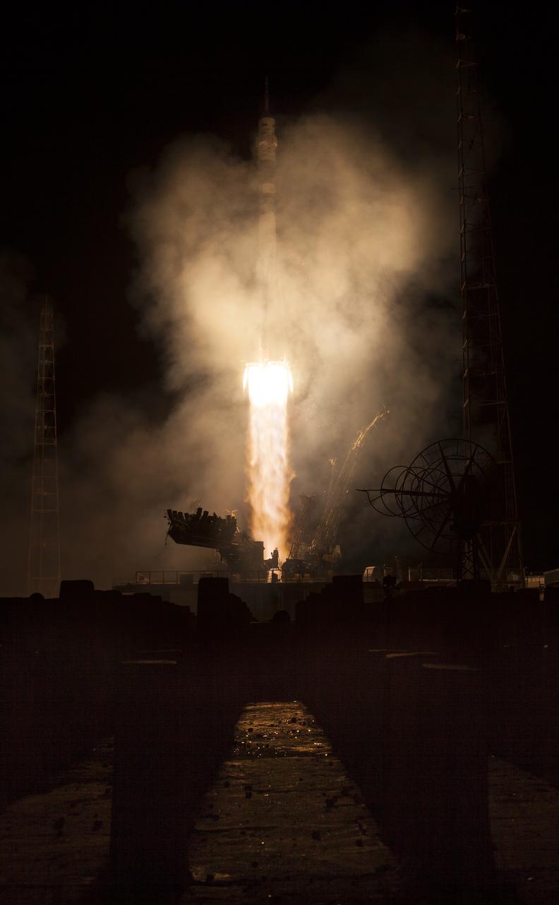 The Soyuz TMA-14M rocket launches from the Baikonur Cosmodrome in Kazakhstan on Friday, Sept. 26, 2014 carrying Expedition 41 Soyuz Commander Alexander Samokutyaev of the Russian Federal Space Agency (Roscosmos), Flight Engineer Barry Wilmore of NASA, and Flight Engineer Elena Serova of Roscosmos into orbit to begin their five and a half month mission on the International Space Station.  (Photo Credit: NASA/Aubrey Gemignani)