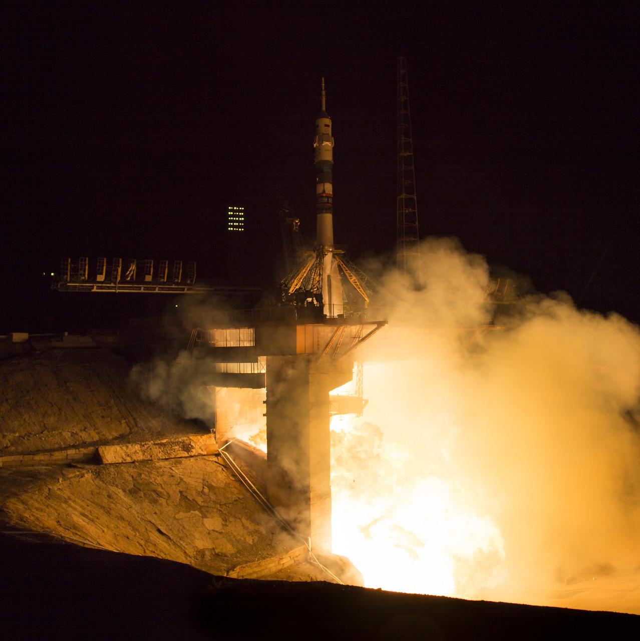 The Soyuz TMA-14M rocket launches from the Baikonur Cosmodrome in Kazakhstan on Friday, Sept. 26, 2014 carrying Expedition 41 Soyuz Commander Alexander Samokutyaev of the Russian Federal Space Agency (Roscosmos), Flight Engineer Barry Wilmore of NASA, and Flight Engineer Elena Serova of Roscosmos into orbit to begin their five and a half month mission on the International Space Station.  (Photo Credit: NASA/Aubrey Gemignani)