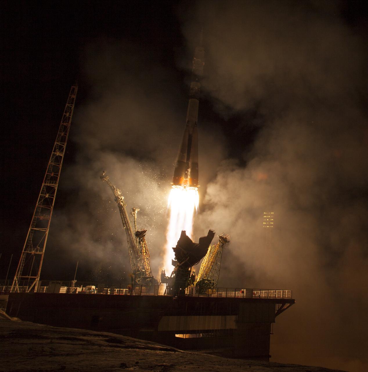 The Soyuz TMA-14M rocket launches from the Baikonur Cosmodrome in Kazakhstan on Friday, Sept. 26, 2014 carrying Expedition 41 Soyuz Commander Alexander Samokutyaev of the Russian Federal Space Agency (Roscosmos), Flight Engineer Barry Wilmore of NASA, and Flight Engineer Elena Serova of Roscosmos into orbit to begin their five and a half month mission on the International Space Station.  (Photo Credit: NASA/Aubrey Gemignani)