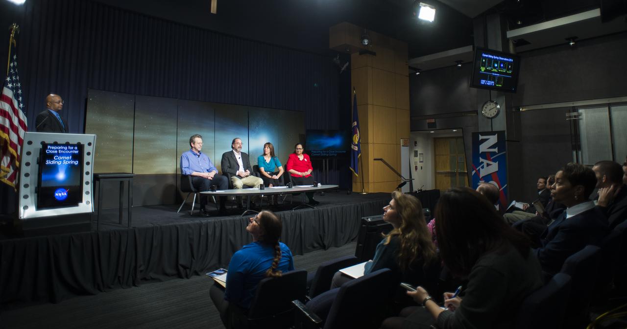 Dwayne Brown, NASA public affairs officer, left, moderates a media briefing where panelist, seated from left, Jim Green, director, Planetary Science Division, NASA Headquarters, Washington, Carey Lisse, senior astrophysicist, Johns Hopkins University Applied Physics Laboratory, Laurel, Maryland, Kelly Fast, program scientist, Planetary Science Division, NASA Headquarters, Washington, and Padma Yanamandra-Fisher, senior research scientist, Space Science Institute, Rancho Cucamonga Branch, California, outlined how space and Earth-based assets will be used to image and study comet Siding Spring during its Sunday, Oct. 19 flyby of Mars, Thursday, Oct. 9, 2014 at NASA Headquarters in Washington. (Photo credit: NASA/Joel Kowsky)