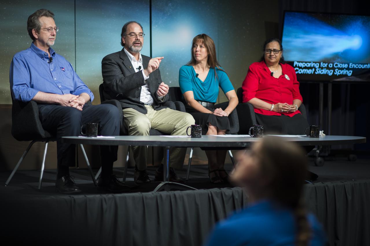 Panelists, from left, Jim Green, director, Planetary Science Division, NASA Headquarters, Washington, Carey Lisse, senior astrophysicist, Johns Hopkins University Applied Physics Laboratory, Laurel, Maryland, Kelly Fast, program scientist, Planetary Science Division, NASA Headquarters, Washington, and Padma Yanamandra-Fisher, senior research scientist, Space Science Institute, Rancho Cucamonga Branch, California, are seen during a media briefing where they outlined how space and Earth-based assets will be used to image and study comet Siding Spring during its Sunday, Oct. 19 flyby of Mars, Thursday, Oct. 9, 2014 at NASA Headquarters in Washington. (Photo credit: NASA/Joel Kowsky)